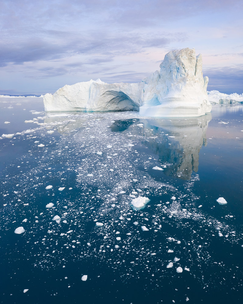 This iceberg, and many next to it, were constantly collapsing, which filled this part of the bay with icebergs. That was great for foreground, but less beneficial in other ways. </br>DJI Mavic II Pro, 1/25 sec, f/6.3, ISO 100. Disko Bay, Greenland