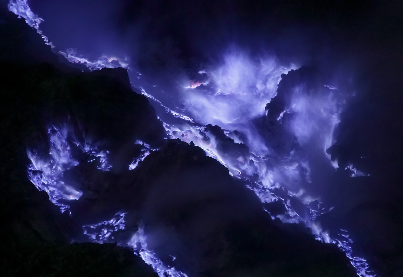 Purple fire in Kawah Ijen. Note the diagonal lines and the two main centers of compositional mass in the top right and in the bottom left, balancing each other.