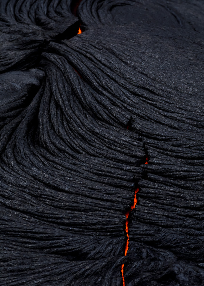 This particular shot has a slightly narrower depth of field than I'd like it to have. The reason is that lava was flowing underground very close to where I was standing, and because of the intense heat, I didn't have the time to set the tripod. I had to shoot hand held and run for my life!