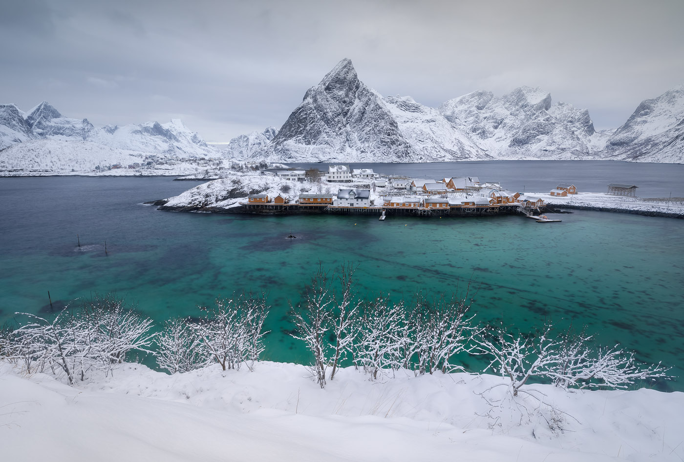 A more–original–than–most shot toward Sakrisøy, Norway. The snow-laden trees in the foreground allowed me to include another layer in the composition and made this shot a bit different. Still, not super original, since this is an overshot location and the orange cabins are well known.  Canon EOS 5D Mark IV, Canon 16–35mm F2.8 III, 3.2 sec, f/13, ISO 100 Sakrisøy, The Lofoten Islands, Arctic Norway
