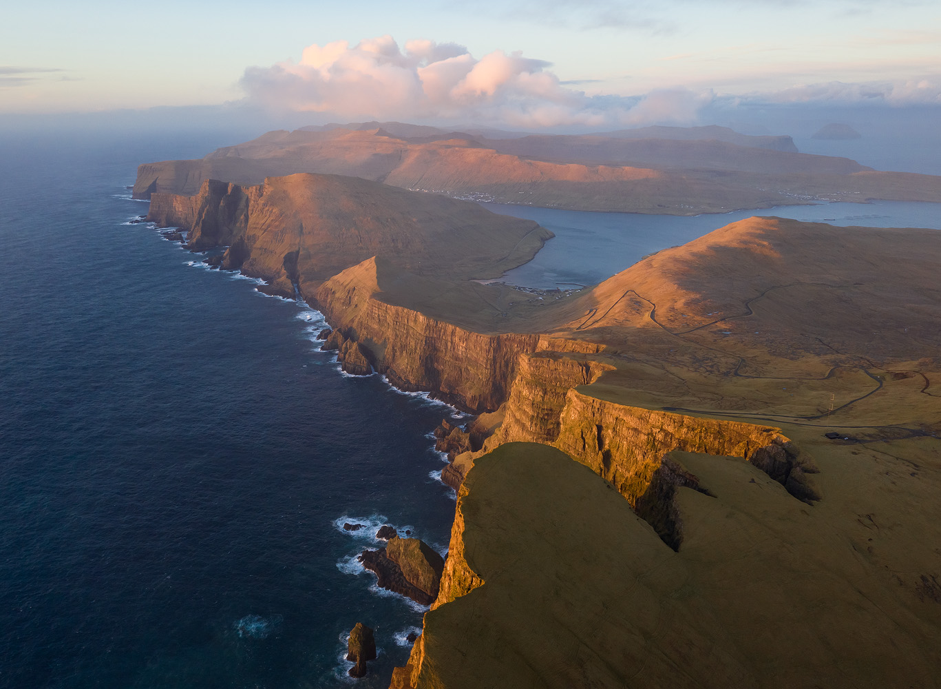 Afternoon light on the magnificent cliffs of Suðuroy. I flew the drone in the harsh winds typical to the Faroes, and as a result, the battery drained so fast I only had 10 or 15 minutes to shoot. </br>DJI Mavic II Pro, 1/80 sec, F5.6, ISO 200. Suðuroy, the Faroe Islands