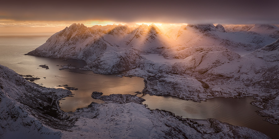 An aerial panorama of one of the most epic light shows I’ve ever seen. Wonderfully clear sun rays were peeking from between the thick cloud layer and the jagged mount Molhøgtinden and its surrounding peaks in the Lofoten Islands during my workshop there. I was stunned with excitement and couldn’t believe my eyes. After a few seconds I shook my head, picked my jaw up and went back to shooting. This image is the result.