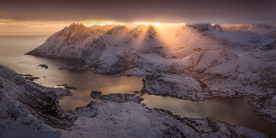 A 2-shot panorama taken from a Cessna above the mountains of Lofoten, Arctic Norway. Due to the aircraft's movement it was a bit of a difficult stitch, but still very possible and worthwhile.