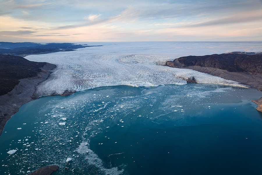 Space in a light plane can be tight, so often you'll only use one body. I would use a 24-70mm in that case. Western Greenland