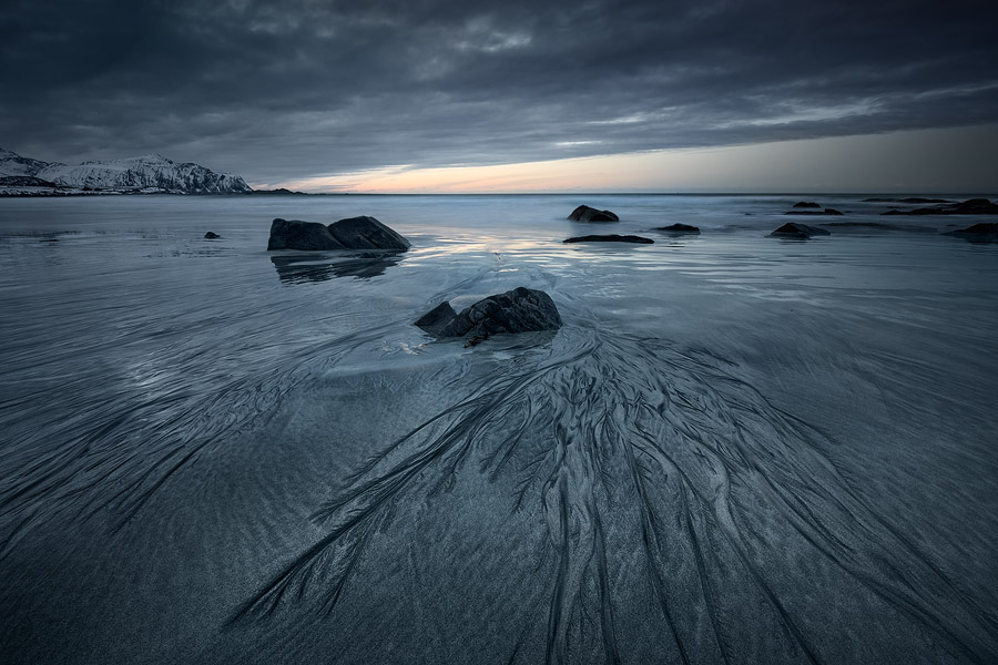 Black and white sands mix and create curious patterns in Skagsanden beach, Lofoten, Norway