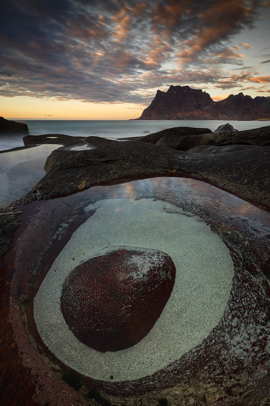 'The Eye' of Utakleiv looks just like a dragon's eyeball - quite a curious, if not intimidating sight. In reality, it's just a ridiculously well-shaped red rock with some sand around it, but that didn't prevent it from becoming the stuff of legends, and certainly a wonderful photographic spot!