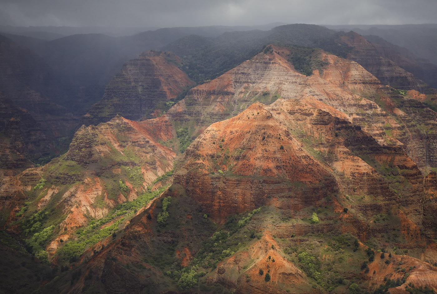 Red Ridges Thick clouds diffuse the afternoon sunlight on the red